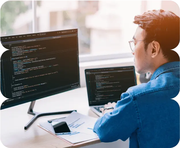 A software developer coding for their custom software projects in a company