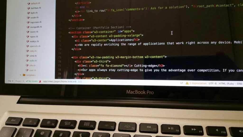 A developer’s workspace showing hands typing on a laptop keyboard with code visible on the screen, reflecting active Flutter app development and modern software engineering workflows.