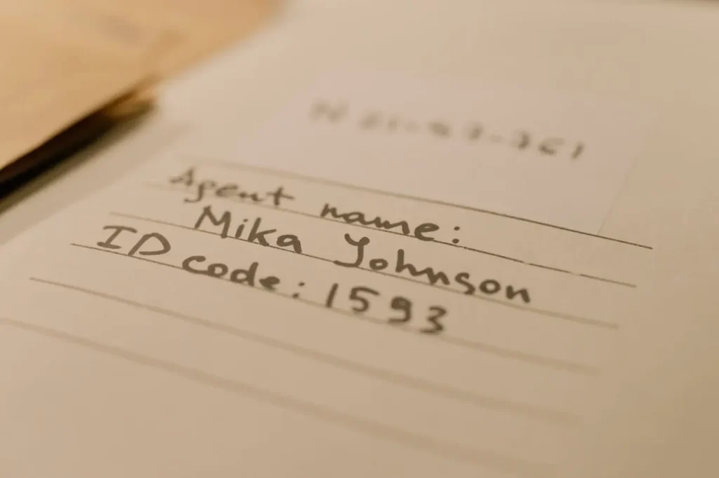 Close-up of personal identification details on paper illustrating sensitive data protection requirements under PDPA for mobile application development Malaysia.