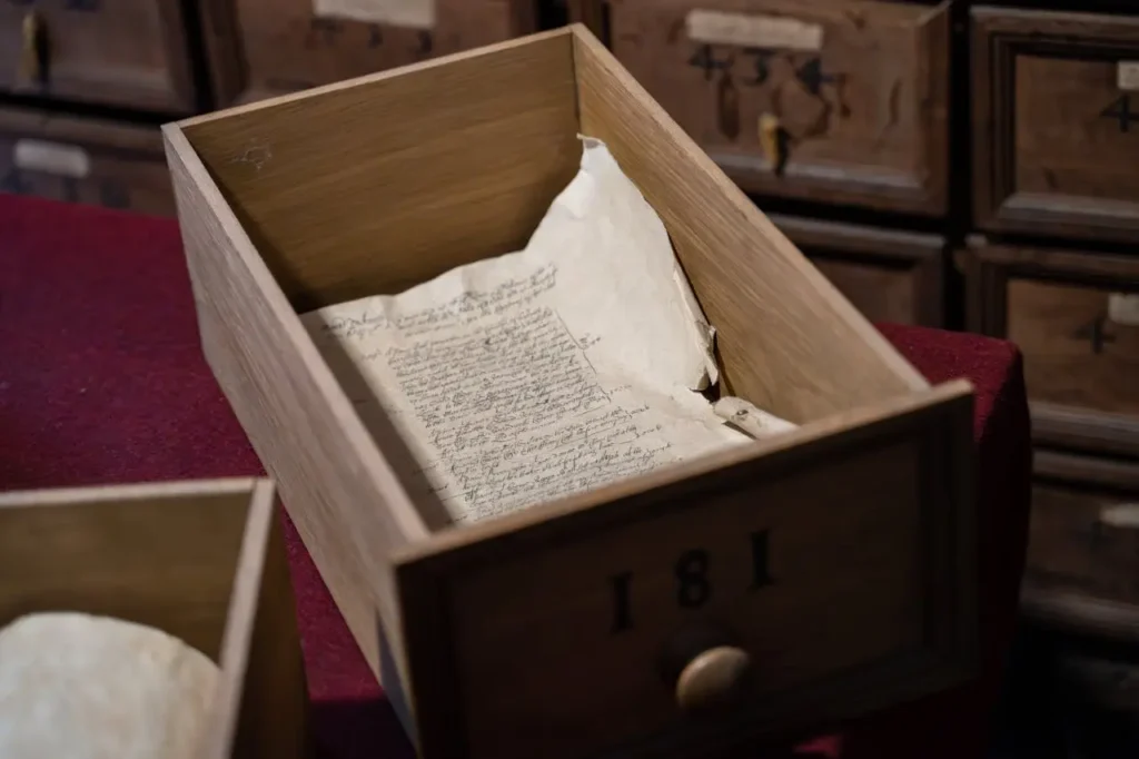 Legacy systems as old wooden drawers with 1881 documents, representing enterprise digital transformation challenges
